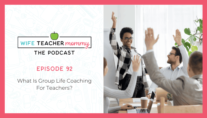 Group meeting with people raising hands- What is group life coaching for teachers?